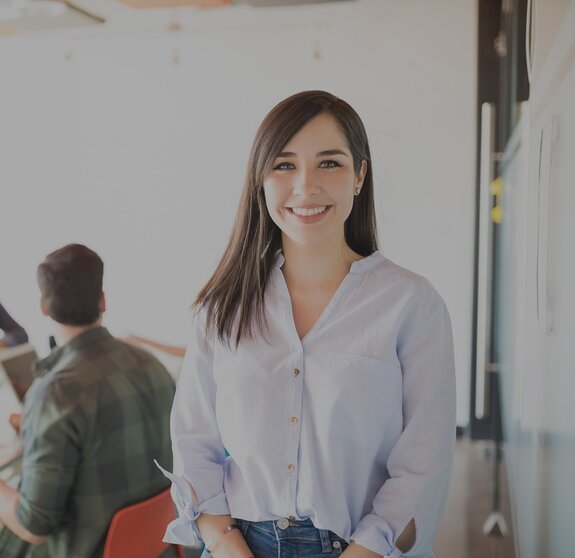 woman looks into camera it jobs timetoact group